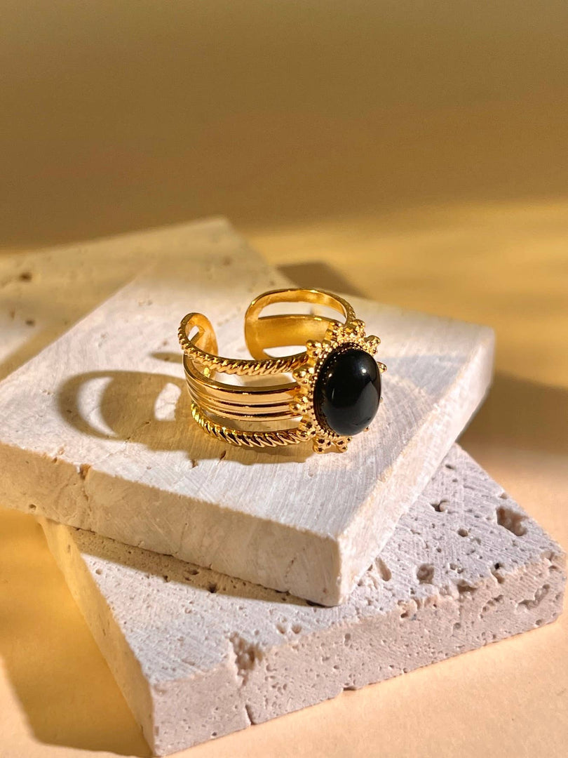 Bague acier inoxydable pierre ovale noire centrale doré