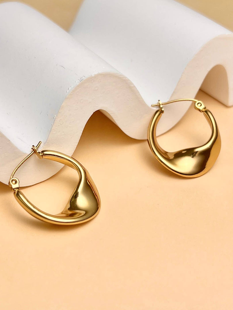 Boucles d’Oreilles Créoles Ondulées Acier Design moderne